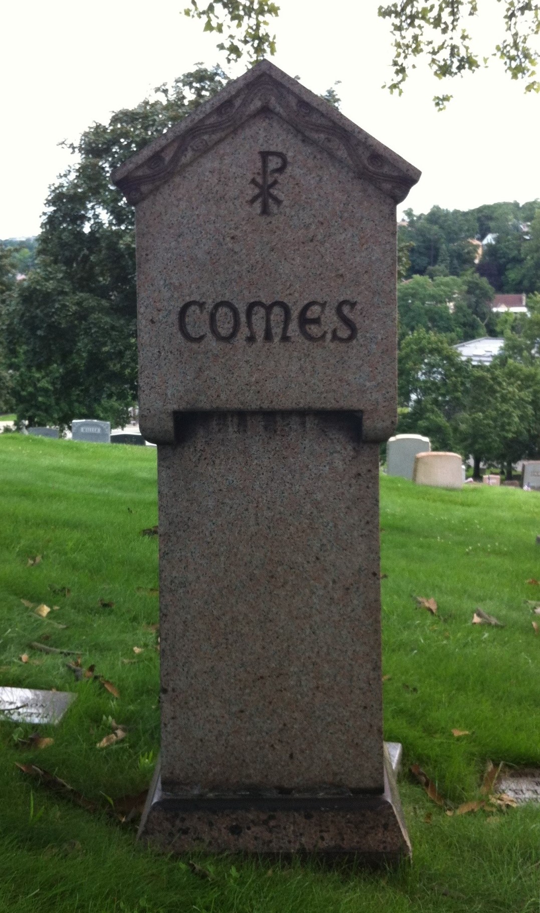 John T Comès gravesite marker back